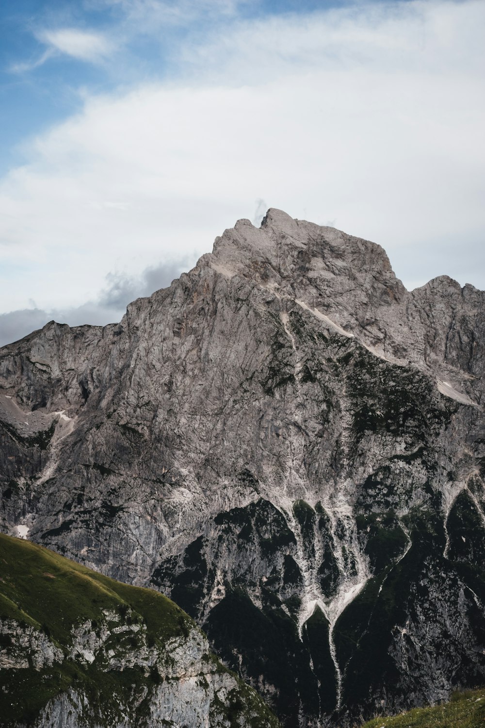 a rocky mountain with a valley below