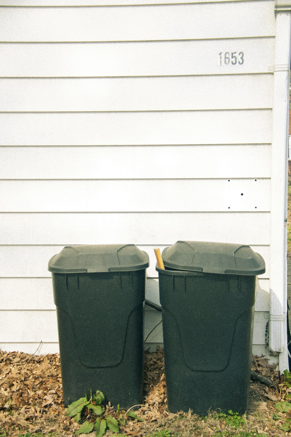 a group of garbage cans