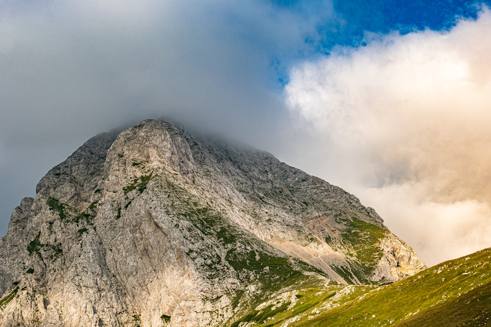 a mountain with clouds