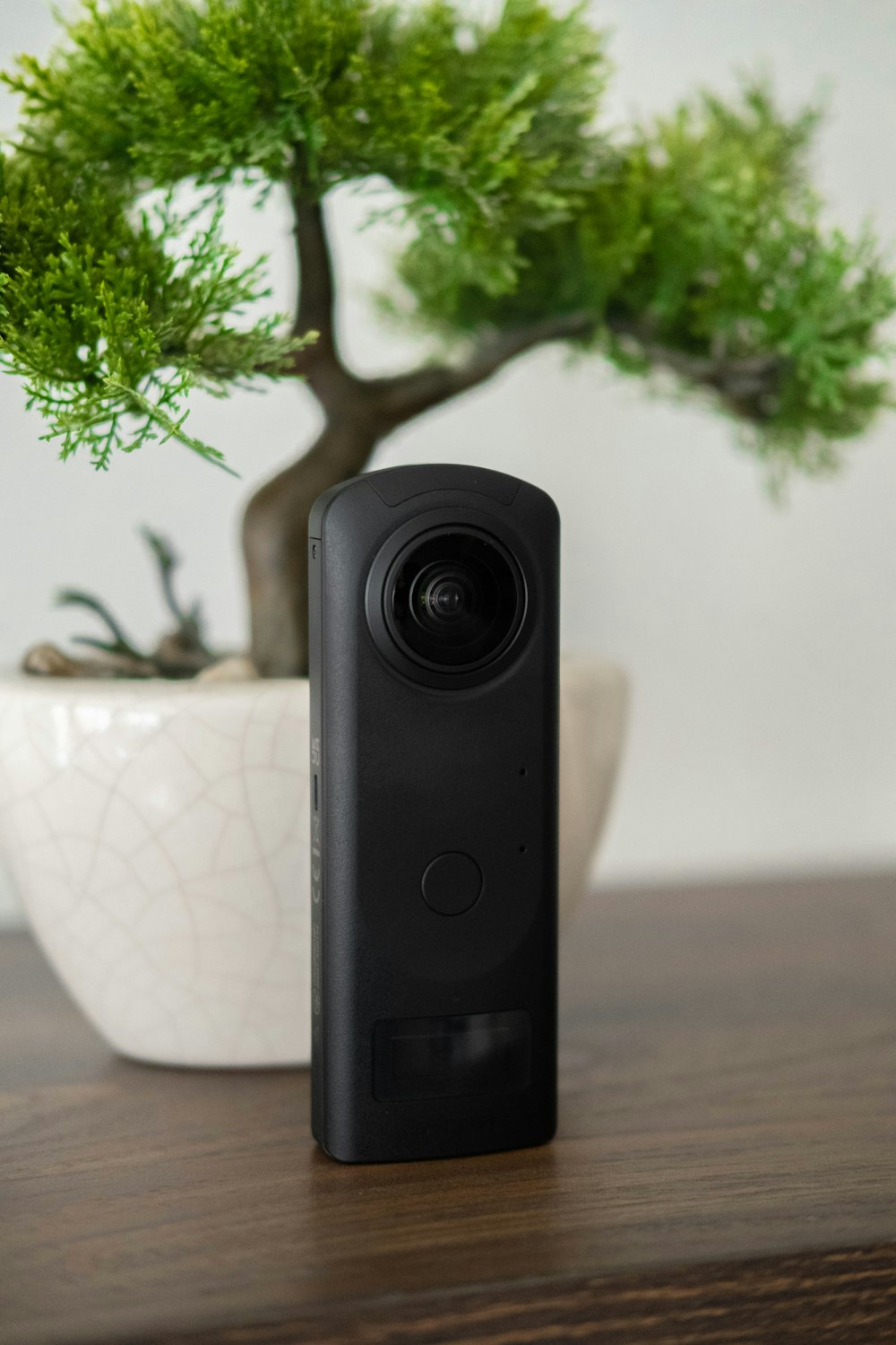 a black speaker on a table