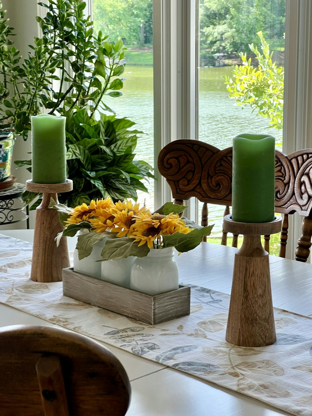 a vase with yellow flowers on a table