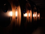 Cruise ship hallway with cabin doors and soft ambient lighting.