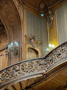 Interior fit-out team installing elegant wood paneling and decorative finishes in a high-end office space.