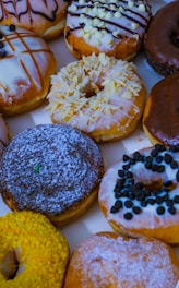 A vibrant display of assorted freshly made donuts.