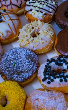 A vibrant display of assorted freshly made donuts.