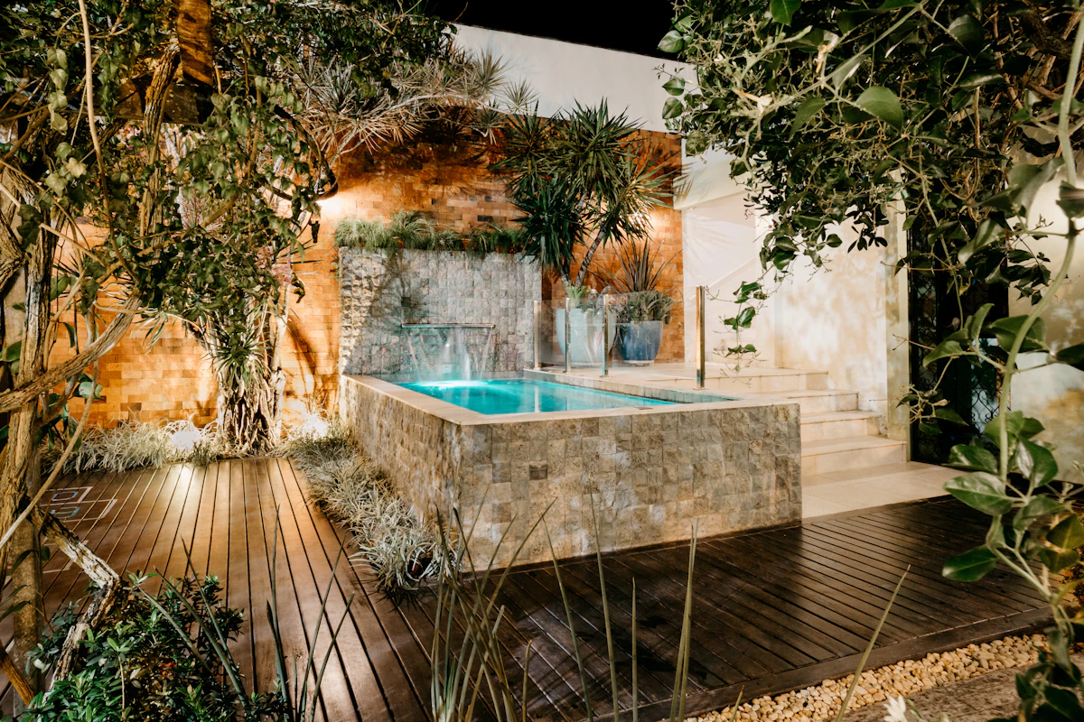 Modern backyard pool and patio with clean landscaping