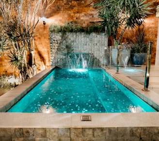 a pool with a waterfall