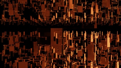 Abstract black and orange geometric shapes symbolizing building blocks.