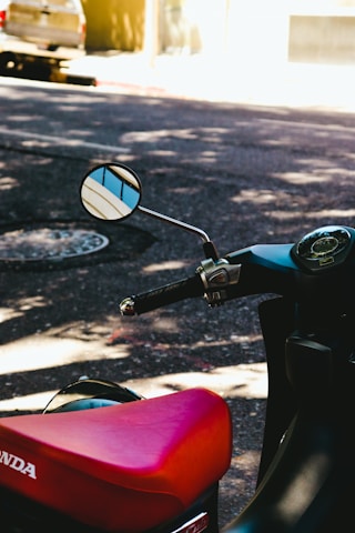 a red scooter with sunglasses