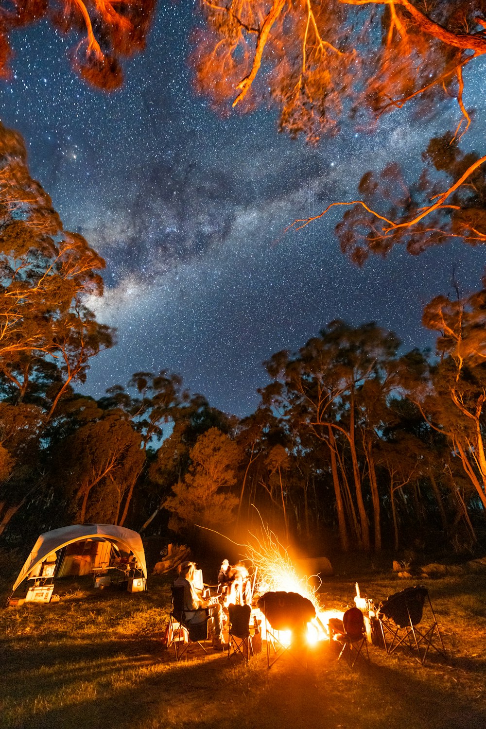 a group of people around a campfire