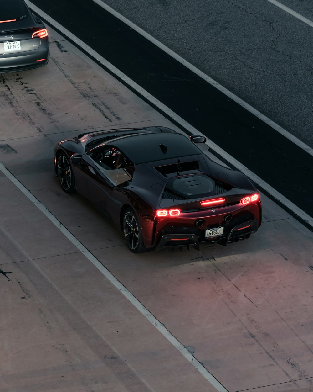 a black sports car on a road