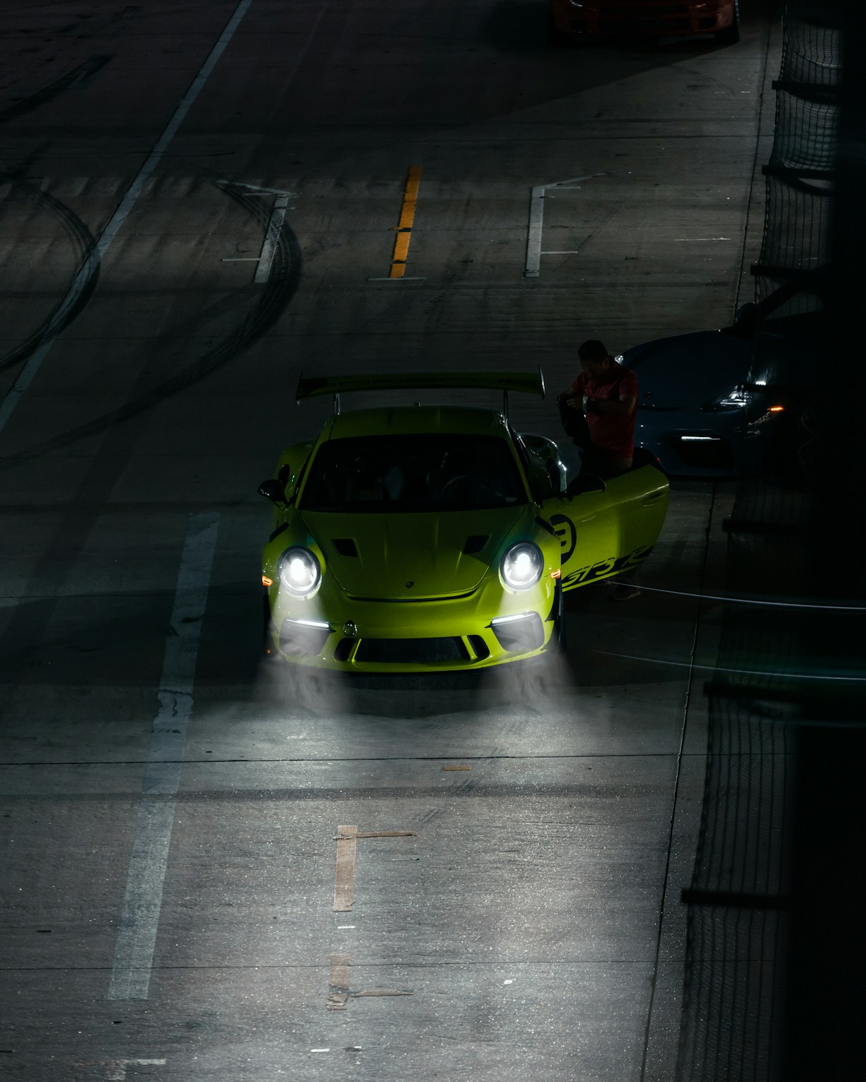 a green car on a road