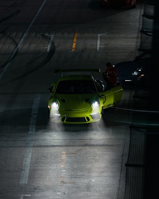 a green car on a road