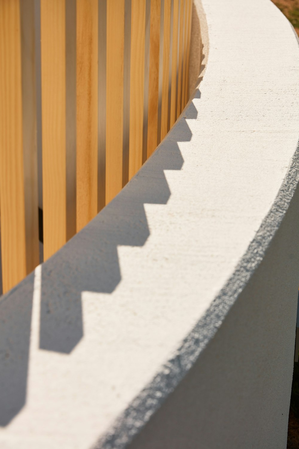 a shadow of a person on a wooden surface