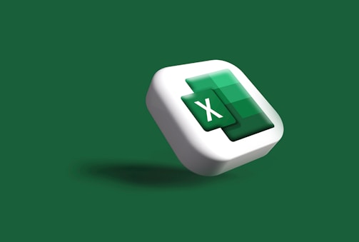 A three-dimensional Microsoft Excel icon with a stylized 'X' prominently displayed in the center. The icon is floating against a dark green background, creating a sense of depth and modernity.