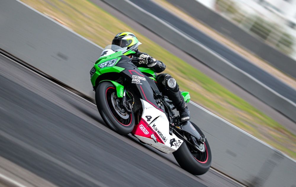 a person riding a motorcycle on a track