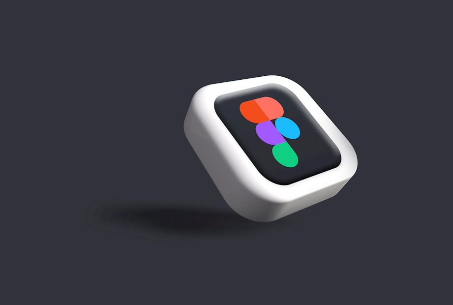 A 3D-rendered icon with a stylized symbol featuring multiple colors, including orange, purple, blue, and green, placed on a black square with rounded corners, surrounded by a white frame. The background is a dark gray, creating a contrasting effect that highlights the floating appearance of the icon.