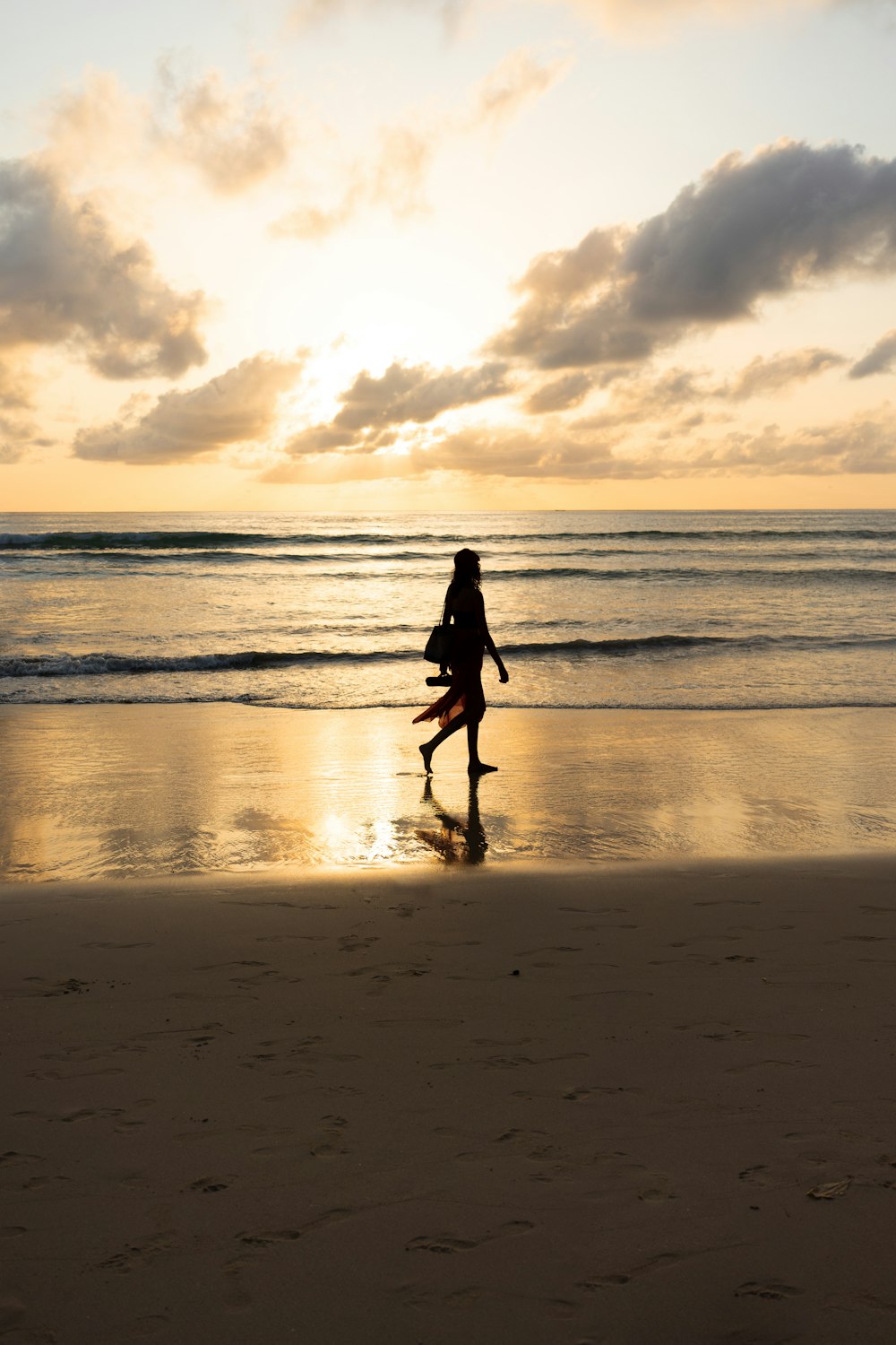 a person walking on the beach