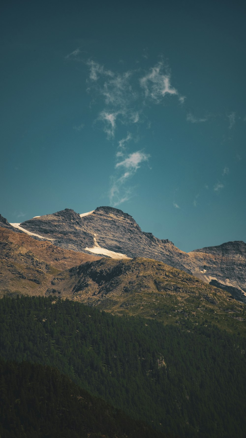 a mountain with a blue sky