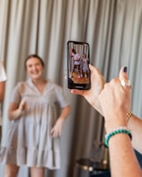 a woman holding a picture of a man