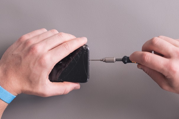 a person holding a black object