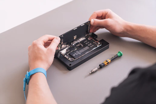 hands holding a black device