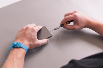 a hand holding a knife