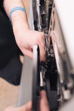 a close-up of a person holding a computer mouse