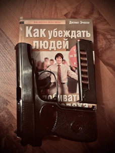 A close-up of a legal book opened to Delaware firearm statutes.