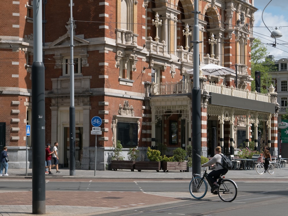 a person riding a bicycle on a street