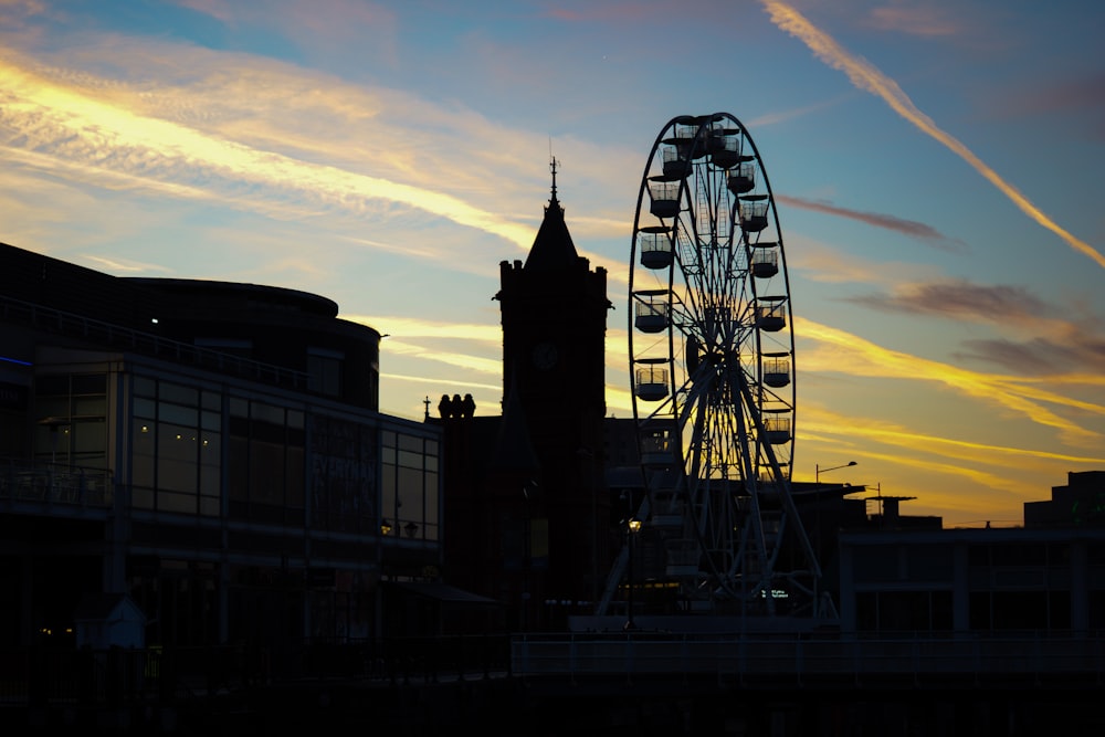 a ferris wheel in front of a building