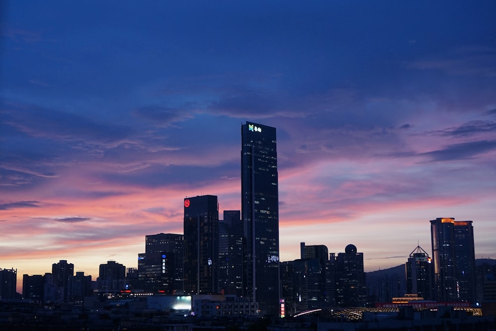 a city skyline at sunset