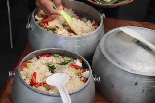 a person cooking food in a pan