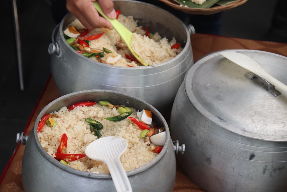 a person cooking food in a pan