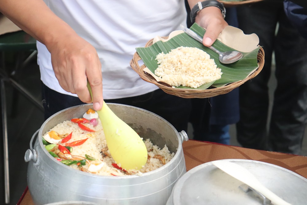 a person preparing food in a bowl