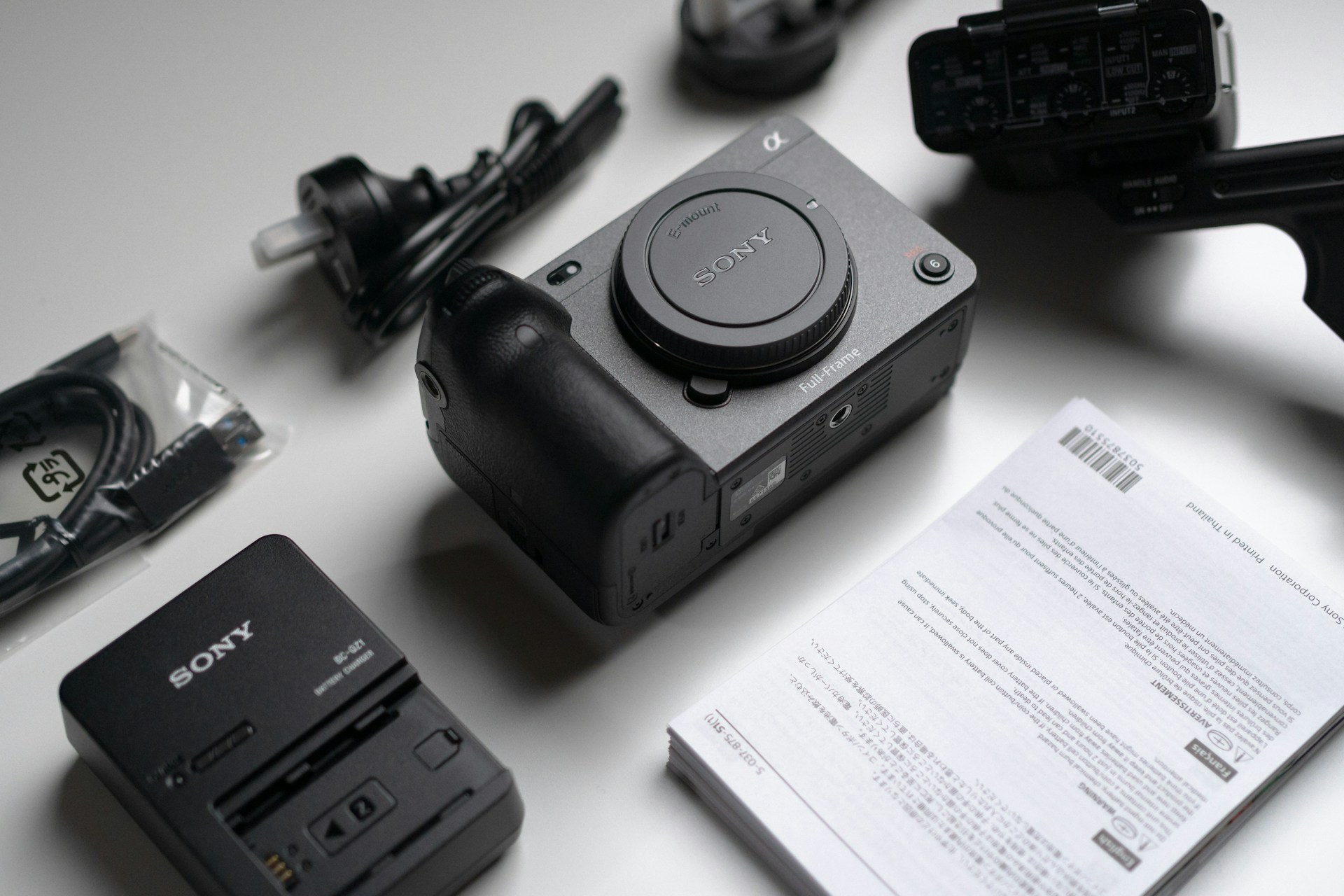 a black and white photo of a telephone on a table