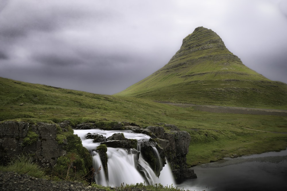 a waterfall in a valley