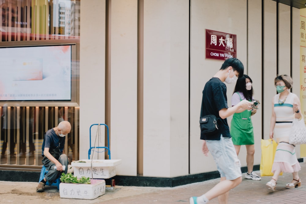 a group of people stand outside a building