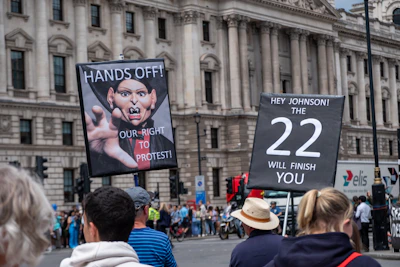 A group of campaigners gathered outside a government building, engaging in peaceful protest.