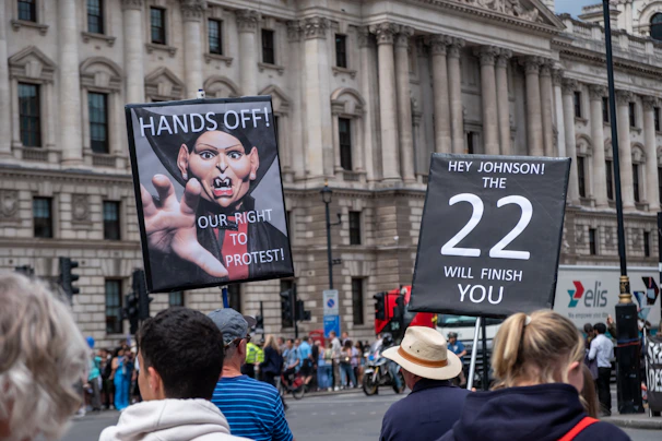 John proudly holding a campaign sign with supporters in Yorktown.