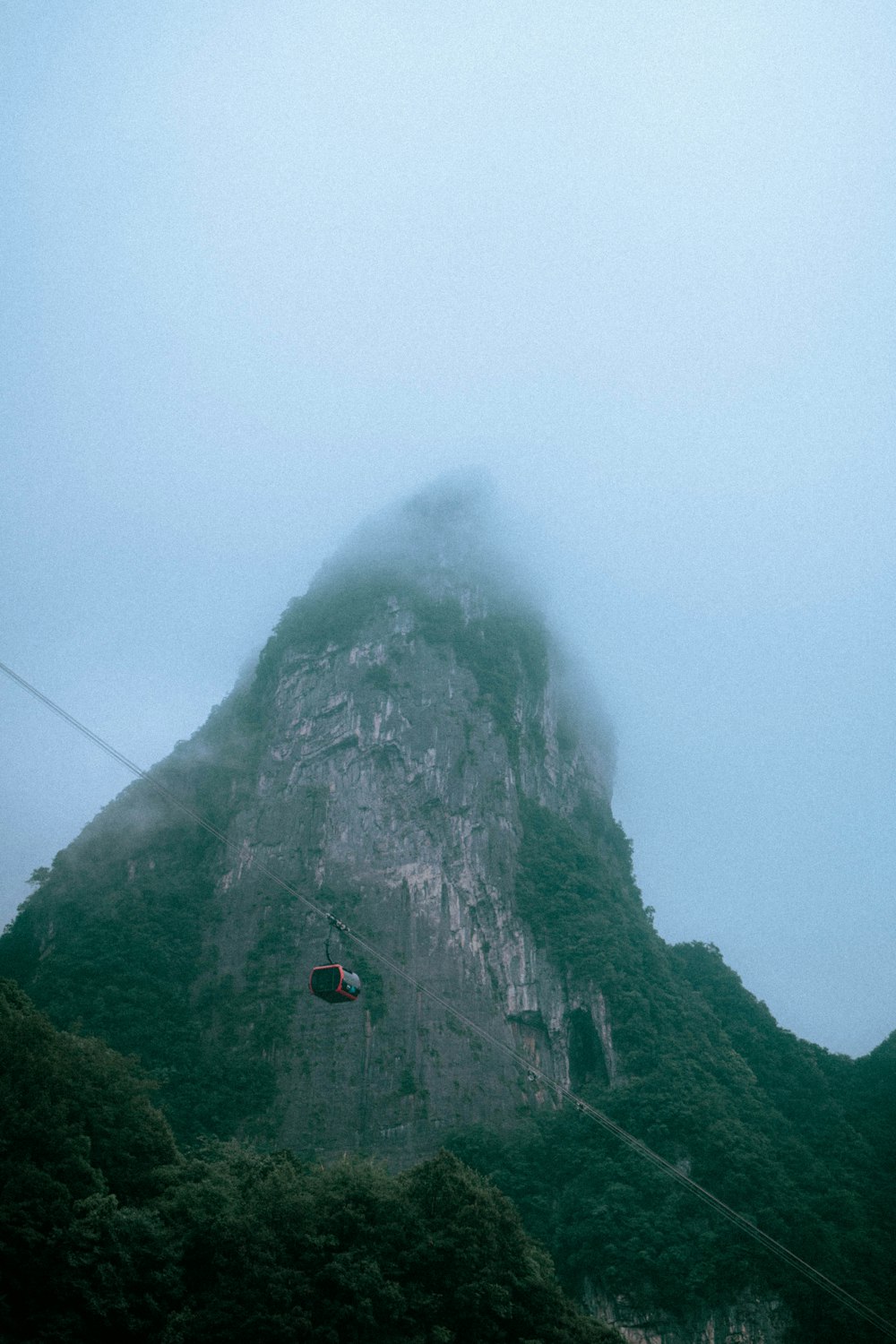 a cable car going up a mountain