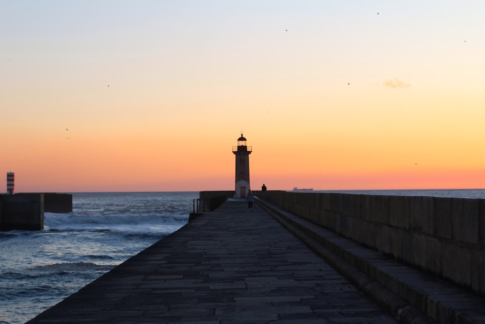 a lighthouse on a pier