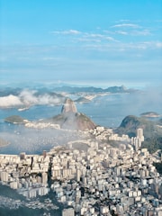 a city with a body of water in the background