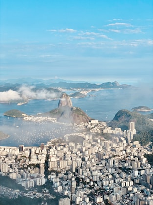 a city with a body of water in the background