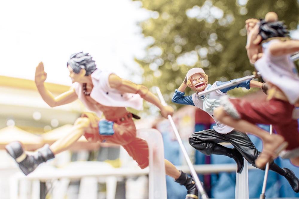 a group of people jumping over a railing