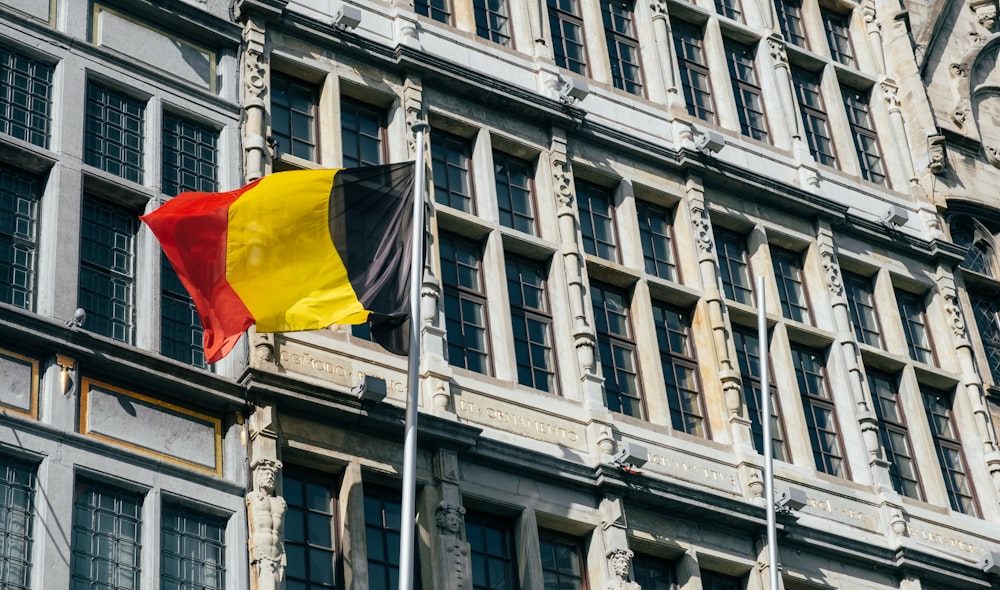 a flag flying in front of a building