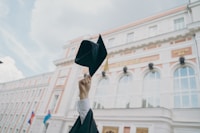 a person holding a black umbrella