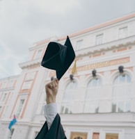 a person holding a black umbrella