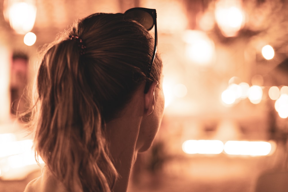 a woman with her hair back