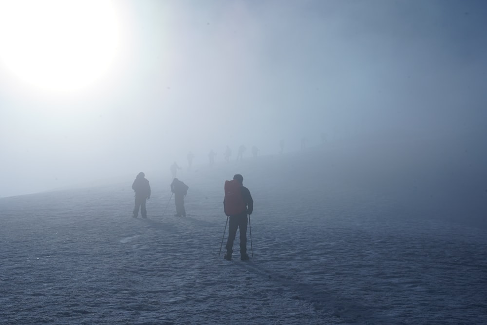 a group of people hiking in the fog